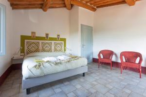 Postel nebo postele na pokoji v ubytování Poderi in Chianti