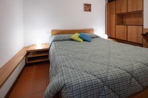 Rúm í herbergi á Agriturismo I Comelli