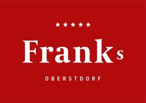 a red sign with four stars on it at Hotel Franks in Oberstdorf