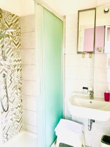 a bathroom with a sink and a shower at Residence Giusti 6 in Milan