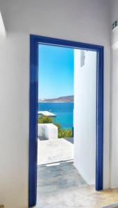an open door with a view of the ocean at Psathi Blue Alpha in Kimolos