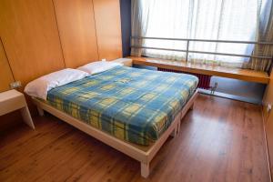 Voodi või voodid majutusasutuse Res. Marilleva 1400 Apt.Solandra toas
