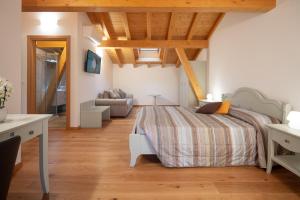Rúm í herbergi á Agriturismo I Comelli