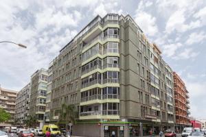 a tall building on a city street with cars at Studio near the Sea and City in Las Palmas de Gran Canaria