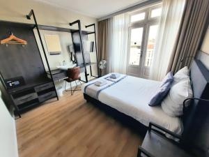 Postel nebo postele na pokoji v ubytování Hotel Washington