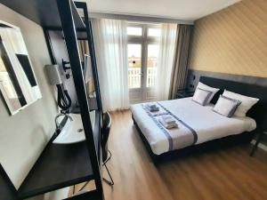 Postel nebo postele na pokoji v ubytování Hotel Washington