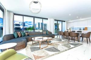 a living room with a couch and a table at LOTUS RESORT in Gold Coast