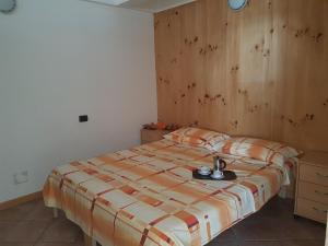Voodi või voodid majutusasutuse Res. Marilleva 1400 Apt.Solandra toas