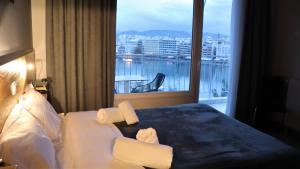 Postel nebo postele na pokoji v ubytování Hara Hotel