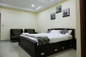 Posteľ alebo postele v izbe v ubytovaní Apsara Residency