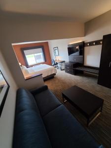 a large living room with a couch and a bed at Holiday Inn Express Hotel & Suites Sheldon, an IHG Hotel in Sheldon