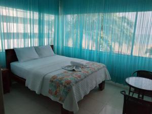 Postel nebo postele na pokoji v ubytování Hotel Casablanca CHIPIPE