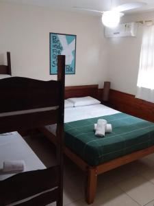 Postel nebo postele na pokoji v ubytování Geko Pousada Paraty