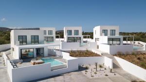 a rendering of a white house with a swimming pool at Cocoon Luxury Villas in Hersonissos