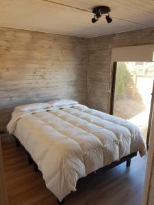 A bed or beds in a room at Costa Lobo