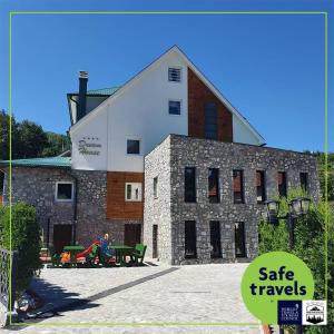 a building with a sign that reads safe travels at Dream House Hotel & Spa in Kolašin