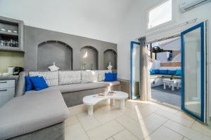 a living room with a couch and a table at Casa Maritina private residence in Fira +165 photos