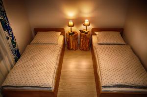 Łóżko lub łóżka w pokoju w obiekcie Apartamenty w Dolinie Gościna