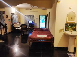Postel nebo postele na pokoji v ubytování Happy Buddha Homestay