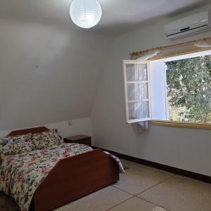 מיטה או מיטות בחדר ב-Chalet ifrane
