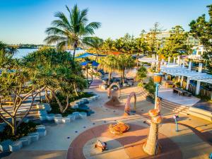 an aerial view of a resort with palm trees and a water park at Salt Yeppoon in Yeppoon