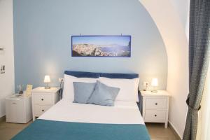 מיטה או מיטות בחדר ב-Chiaia Suites