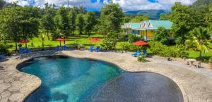 an aerial view of a swimming pool at a resort at Rosalie Bay Eco Resort & Spa in Rosalie