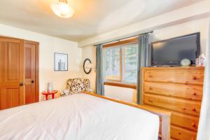 a bedroom with a bed and a television on a dresser at Sugar House in Soda Springs