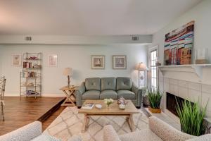 a living room with a couch and a fireplace at 110 Evian 2 BR Shipyard in Hilton Head Island
