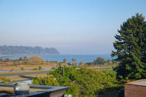 a view of the ocean from a roof of a building at Bayview Hotel in Courtenay