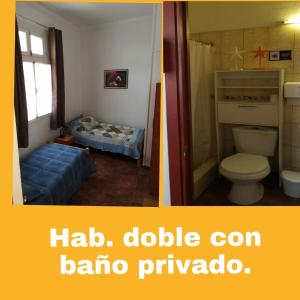 a bathroom with a toilet and a bathroom with a bed at La Otra Vista in Valparaíso
