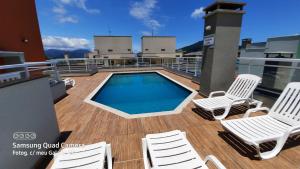a swimming pool on the deck of a cruise ship at Vila Monrealle in Ubatuba