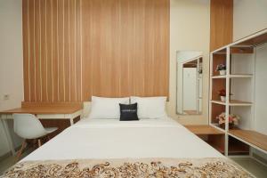 Katil atau katil-katil dalam bilik di Ngampilan Residence Yogyakarta Mitra RedDoorz