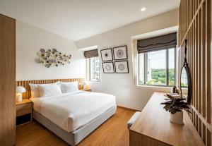 מיטה או מיטות בחדר ב-Ann Hotel & Spa Khem Beach PQ