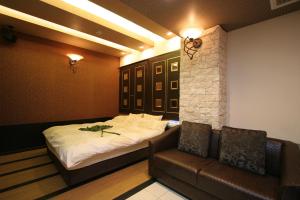 Postel nebo postele na pokoji v ubytování Hotel NEX check in 13時から