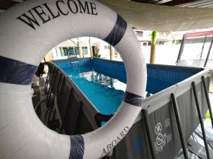 a white and blue life raft on a boat at beXuan-Private Pool-Town Area-Snooker-BBQ-12-18Pax in Ipoh
