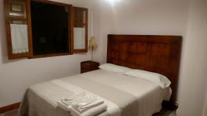 Postel nebo postele na pokoji v ubytování Las Casitas de Papel