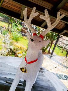 a stuffed reindeer is hanging from a ceiling at Hotel Tanne in Bansko