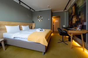 The Rilano Hotel Stuttgart Böblingen tesisinde bir odada yatak veya yataklar