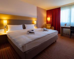 The Rilano Hotel Stuttgart Böblingenにあるベッド