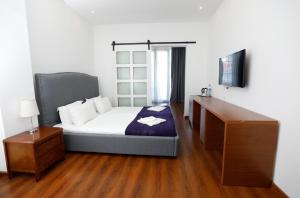 Letto o letti in una camera di Hotel Homey Kobuleti