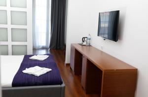 Letto o letti in una camera di Hotel Homey Kobuleti