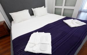 Letto o letti in una camera di Hotel Homey Kobuleti