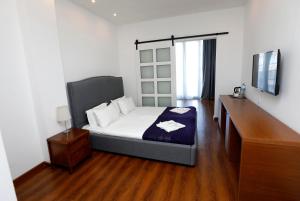 Letto o letti in una camera di Hotel Homey Kobuleti