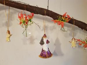 a group of ornaments hanging on a wall at SintAnna B&B PetitHotel in Yerseke