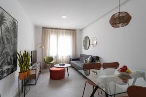 a living room with a couch and a table at Royal Flats in Las Palmas de Gran Canaria