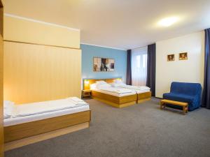 Postel nebo postele na pokoji v ubytování Hotel Trend