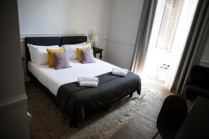 A bed or beds in a room at Holidays Suites Navona