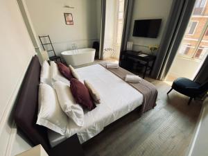 A bed or beds in a room at Holidays Suites Navona