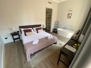 A bed or beds in a room at Holidays Suites Navona